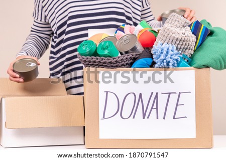 Volunteer preparing animal donation box for animal shelter