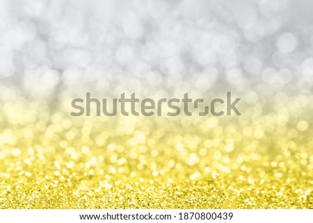 Abstract background with blurred glitter lights.