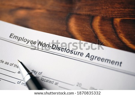 Legal document Employee Non-Disclosure Agreement on paper close up.
