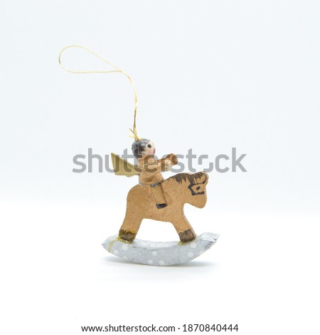 Christmas tree decoration wooden horse isolated on light background