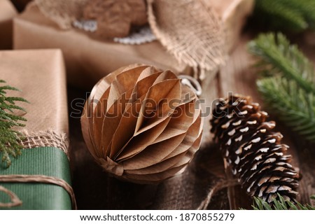 creative diy brown paper ornament for Christmas in vintage style on wooden table