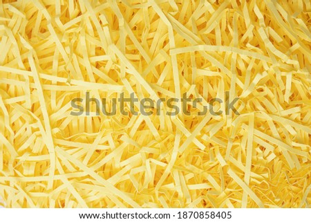 Abstract background with bright yellow paper stripes with torn edges.