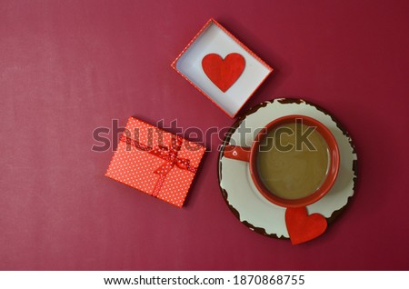 Holiday greeting card for Valentine's day concept coffee with milk cup heart shaped decor gift box top view space for text