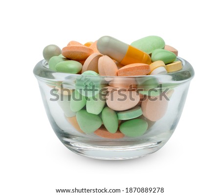 pill in glass cup isolated on white background ,include clipping path