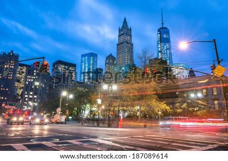 New York City traffic - Blurred lights at blue hour with Manhattan skyline in the background