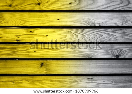 Demonstrating trendy colors 2021 - Gray and Yellow. surface of wooden table