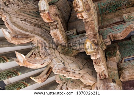traditional multicolored paintwork on wooden roof  close up photo