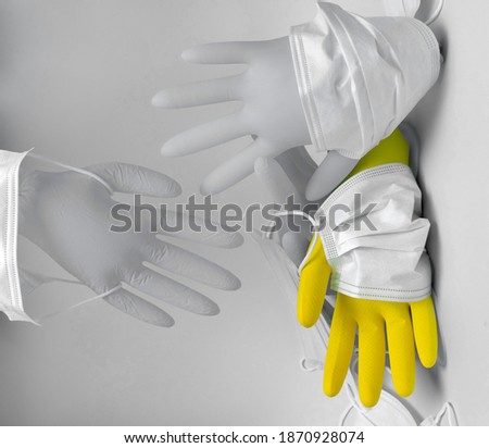 yellow glove and a gray glove, disposable mask