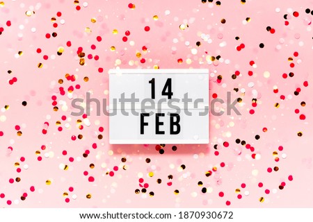 Saint Valentine's day  festive background. Bokeh lights and confetti February 14 . Top horizontal view copyspace. Royalty-Free Stock Photo #1870930672