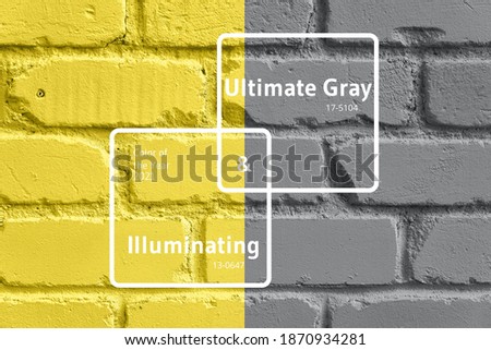 Demonstrating trendy Color of the Year 2021. Illuminating Yellow and Ultimate Gray. Duotone brick wall texture. Background with copy space for design.