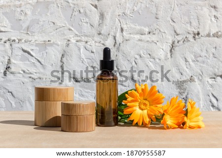 Natural cosmetics with herbal ingredients. Natural calendula oil. Blank packaging for labels