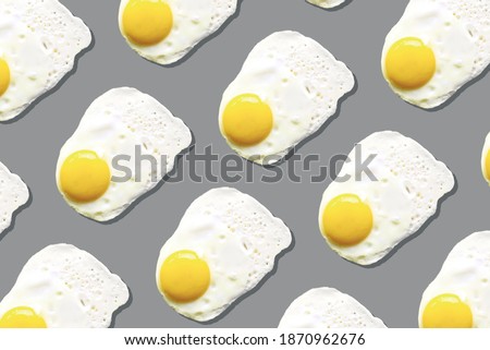 Egg pattern, food concept. Demonstrating trendy Color of the Year 2021. Illuminating Yellow and Ultimate Gray