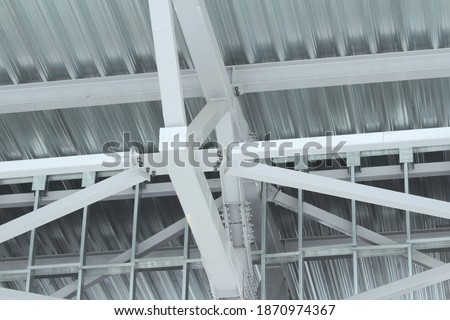 An old steel metal farm. structure of metal structure of frame-type industrial building. Lightweight metal frame construction. High quality photo