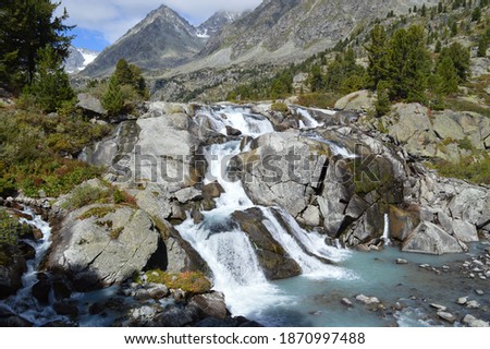Altai siberian mountains in summer with river and forest and rocks 