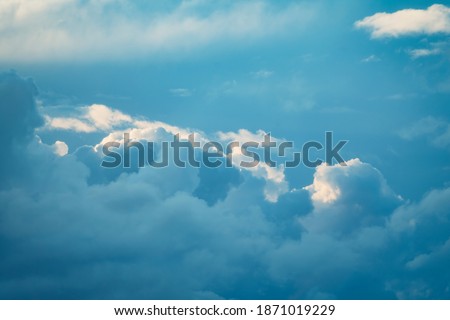 Thunderstorm cloud in the sky at sunset texture background. Blue abstract shades. True high resolution photography