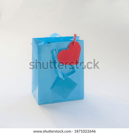 Gift for men, blue package and silver heart, isolated on white background