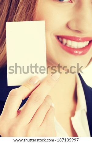 Beautiful caucasian business woman holding small personal card.