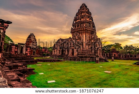 Landscape of Phimai Historical Park with sunset sky. Landmark of Nakhon Ratchasima, Thailand. Travel destinations. Historic site is ancient. Ancient building. Khmer temple classical architecture. Royalty-Free Stock Photo #1871076247