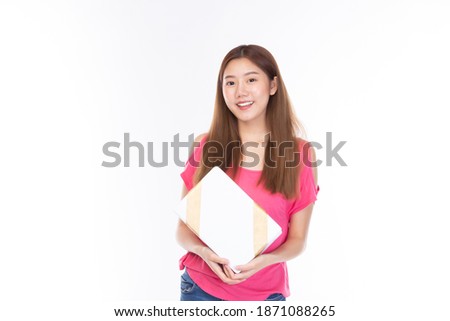 Attractive asian woman holding gift box in christmas, new year, valentine day, birthday celebration concept. Portrait of smiling happy pretty girl hold gift box on white background.