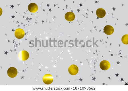 gold shiny flying confetti frame on a ultimate gray background festive backdrop for any christmas project