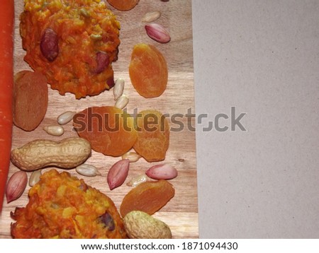 carrot diet cookies with carrots, dried apricots, peanuts and sunflower seeds with space for text. High quality photo
