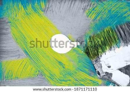 Old paintbrush recolors background blue 2020 to yellow and gray 2021. Trendy color Ultimate Grey and Illuminating of the 2021 year.
