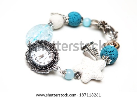 Elegant and modern bracelet made from volcanic lava rock, glass and silver on white background
