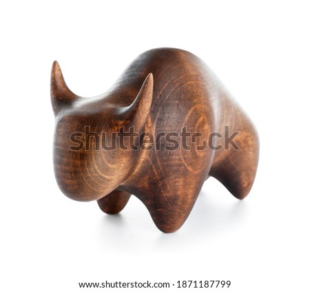 Wooden figurine of bull on white background. Symbol of year 2021
