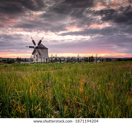 Nice old windmill in Tés, Hungary in sunset