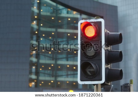 Traffic light with red light on, signal open to go ahead. Sparkly Traffic light over urban intersection. Red light in the form of stars.