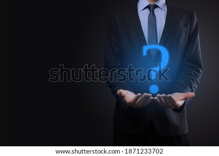 Businessman man hand hold interface question marks sign web. Ask quiestion online, FAQ concept, what where when how and why, search information on internet.