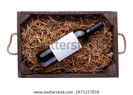 White wine bottles packed in open wooden box isolated on white background