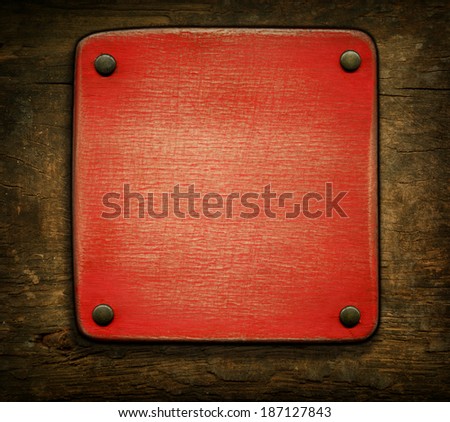 Wooden plaque attached with rivets