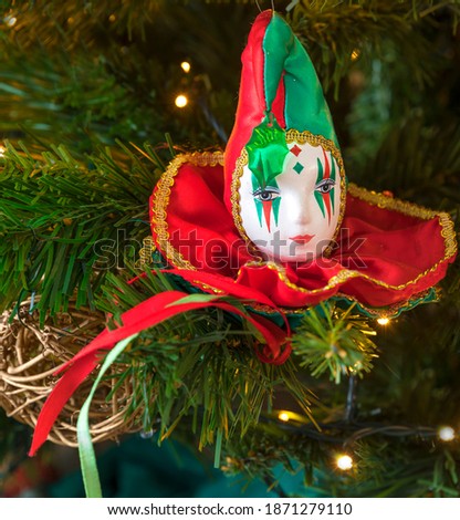 Harlequin Hanging Decoration. Isolated.Face of harlequin hanging as seasonal decor from Christmas tree. Stock Image.