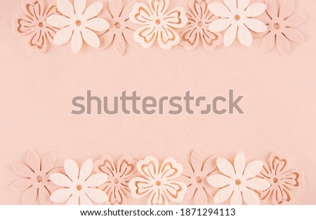 Decorative soft flowers made of felt. Creative background for Easter, Mother's day, happy birthday greeting cards.