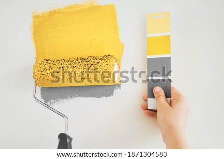Close up paint brush and color charts. Concept of color of the year.  Royalty-Free Stock Photo #1871304583