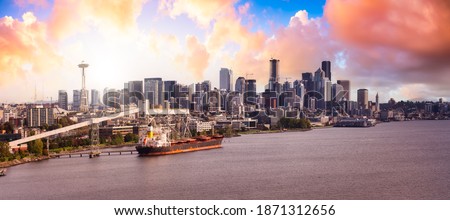 Downtown Seattle, Washington, United States of America. Aerial Panoramic View of the Modern City on the Pacific Ocean Coast. Dramatic Sunrise Sky Art Render.
