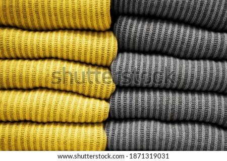 Handmade knitting wool texture background.Illuminating and Ultimate gray Pantone color of the year 2021