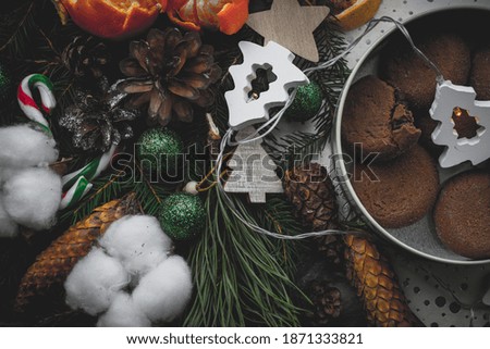 chocolate cookies on a Christmas background in New Year decorations top view
