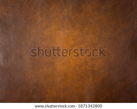 Genuine light brown cattle leather texture background. Macro photo