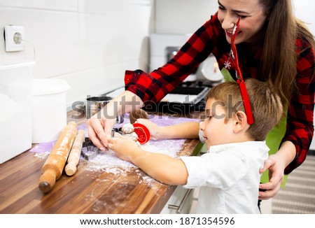 Mother and son having fun baking cookies