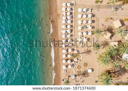 Aerial view of the shoreline, with shade suds in Eilat, The North Beach Royalty-Free Stock Photo #1871374600
