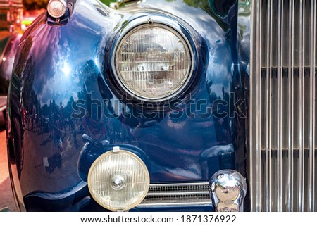 blue car, headlight close-up. High quality photo