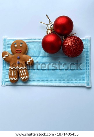 christmas lockdown copy space wallpaper. Medical Christmas protective face mask with winter decorations 