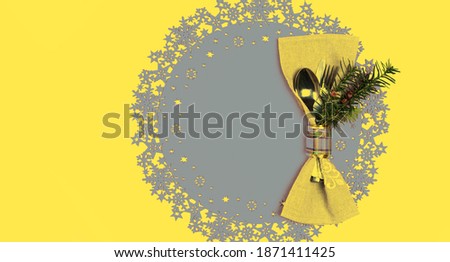 Top view Christmas And New Year Holiday Table Place Setting. Concept of Color of the Year 2021 with bright illuminating yellow and gray colours. Winter holidays table. Flat lay, copy space. banner.