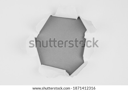 Texture of Ultimate gray colored paper with hole. Color trend concept 2021. Gray background with copy space