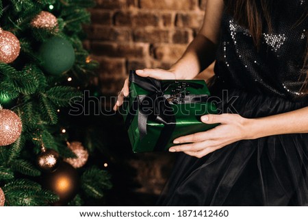 beautiful green Christmas decorations and gifts under the Christmas tree