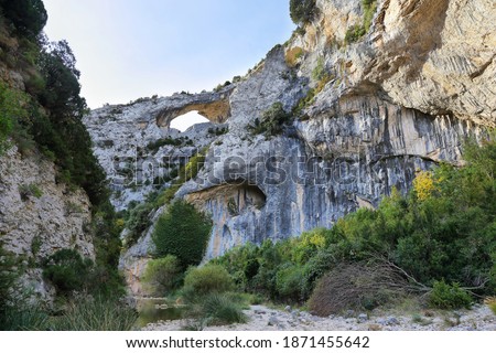 Big hole in climbig area of Sierra de Guara National Park near Rodellar village, Huesca province in Aragon, Spain Royalty-Free Stock Photo #1871455642