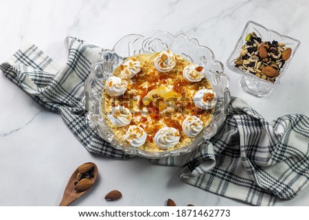 Stock photo of sweet Homemade fruit cocktail trifle dessert with custard and cake