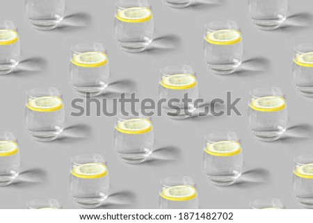Pattern of glass of lemonade a gray background. Colors 2021.